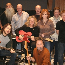 Pictured in the photo with Carole and Reba are: L-R top row: Leland Sklar (bass), Russ Kunkel (drums), Dean Parks (guitar), J.D. Maness (steel). Matt Rollings (piano).  L-R bottom row: Tom Bukovac (guitar), Tony Brown (producer). Photo by Glenn Sweitzer