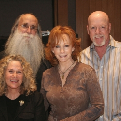 Pictured in the photo with Carole and Reba are: L-R: Leland Sklar (bass) and Russ Kunkel (drums). Photo by Glenn Sweitzer