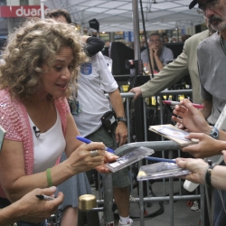 Signing albums & CD's.Photo by Elissa Kline