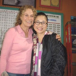 Carole with Keiko Agena in between takes on the set of Gilmore Girls - Nov. 2005. Photo by CKP