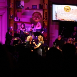 Louise Goffin passes the mic to Carole.  Photo by Elissa Kline